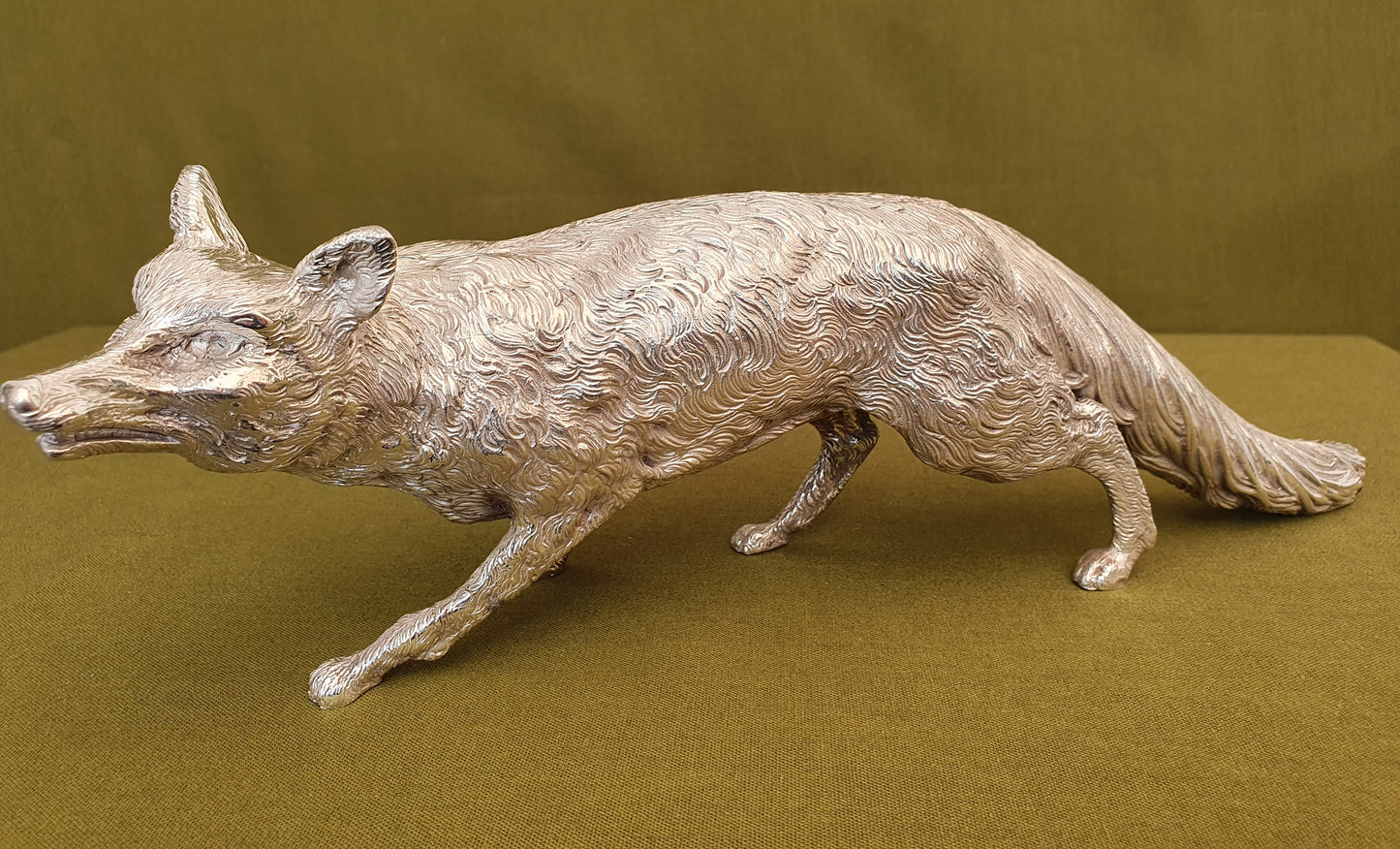 Solid silver fox. Cast, with fine hand chased detail. 32CM long. 1.35 KG