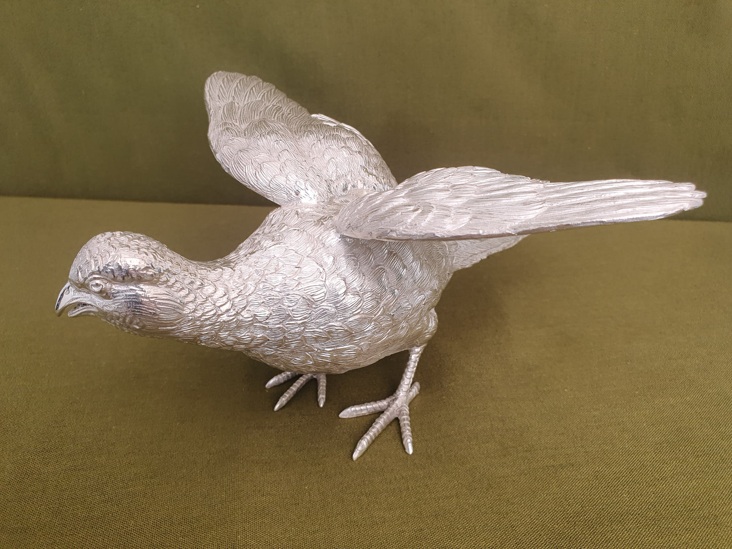 Pair of solid silver pheasants. Cast, fine hand chased detail. 1.945KG. 28 & 32 CM.
