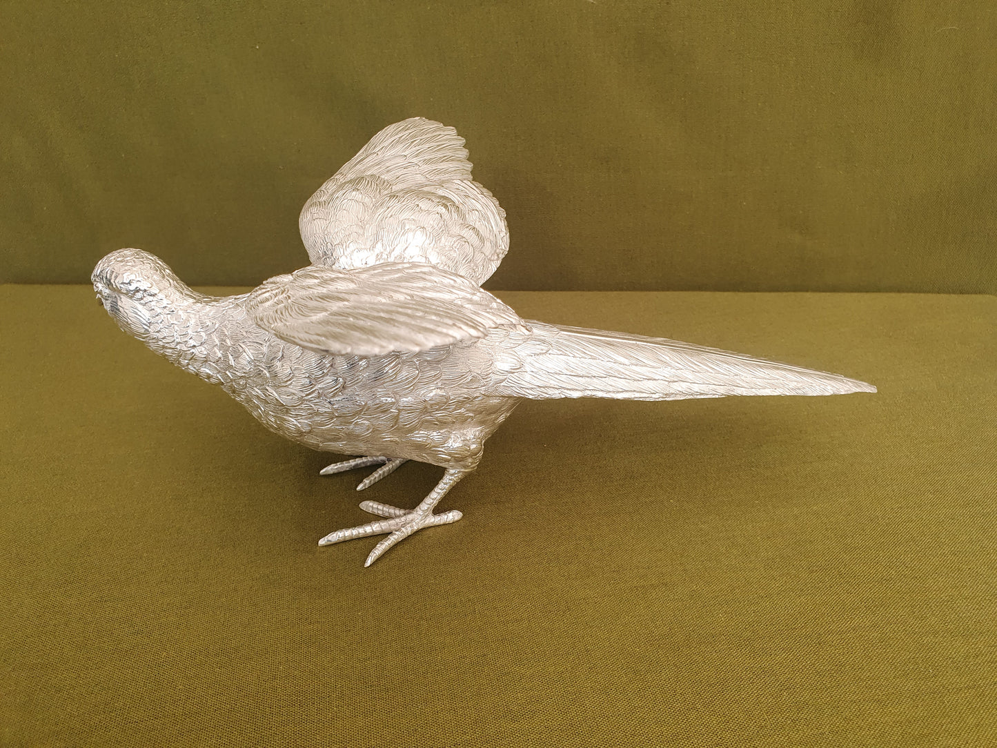 Pair of solid silver pheasants. Cast, fine hand chased detail. 1.945KG. 28 & 32 CM.
