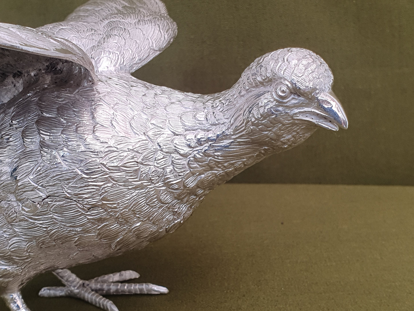 Pair of solid silver pheasants. Cast, fine hand chased detail. 1.945KG. 28 & 32 CM.