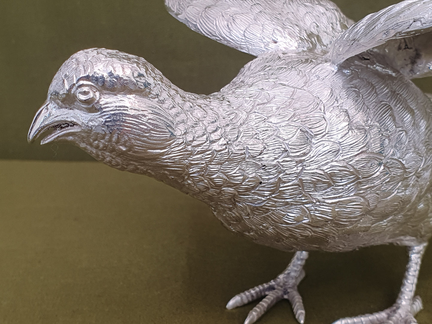 Pair of solid silver pheasants. Cast, fine hand chased detail. 1.945KG. 28 & 32 CM.
