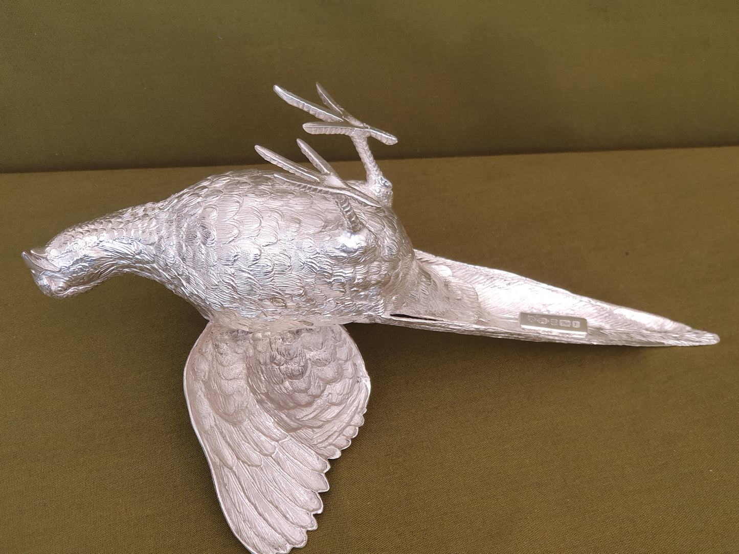 Pair of solid silver pheasants. Cast, fine hand chased detail. 1.945KG. 28 & 32 CM.