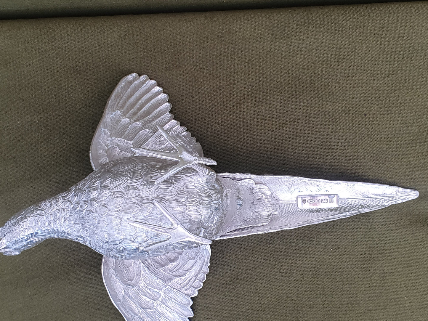 Pair of solid silver pheasants. Cast, fine hand chased detail. 1.945KG. 28 & 32 CM.