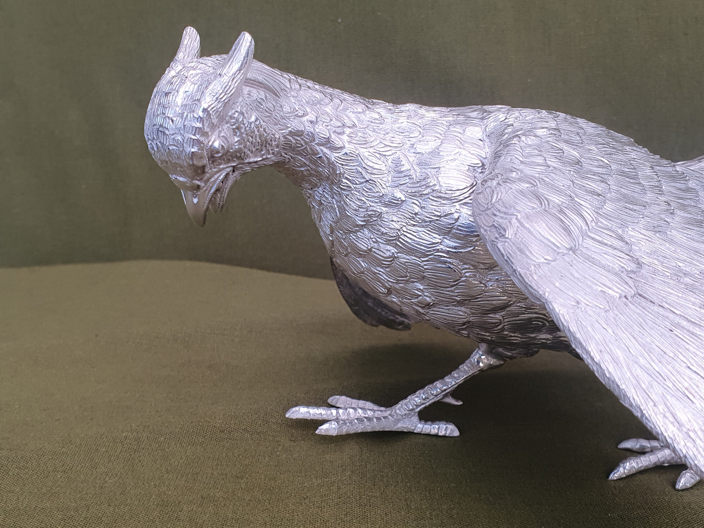Pair of solid silver pheasants. Cast, fine hand chased detail. 1.945KG. 28 & 32 CM.
