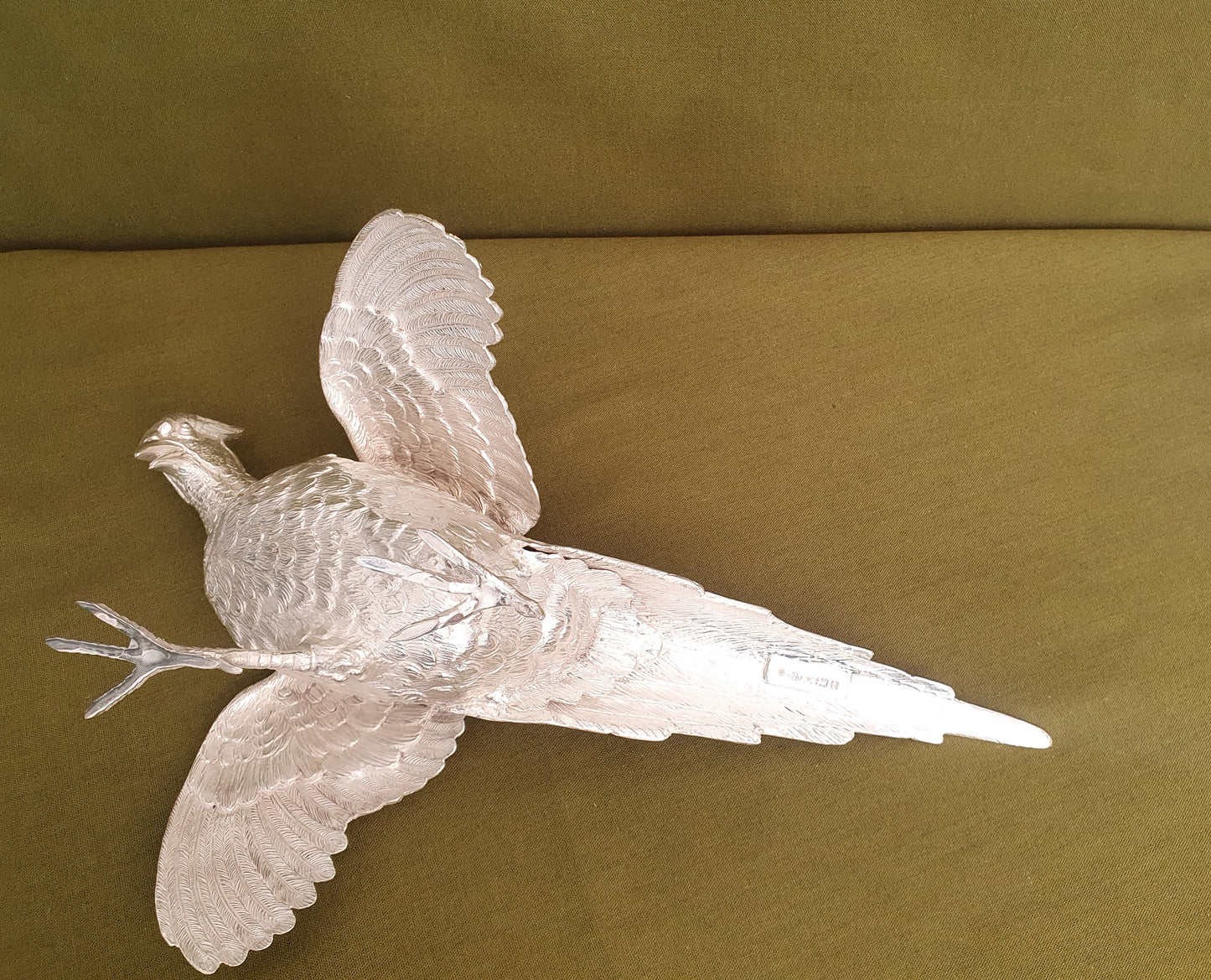 Pair of solid silver pheasants. Cast, fine hand chased detail. 1.945KG. 28 & 32 CM.
