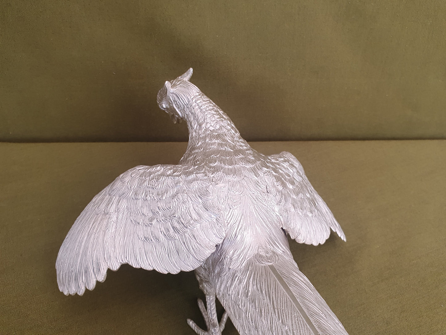 Pair of solid silver pheasants. Cast, fine hand chased detail. 1.945KG. 28 & 32 CM.