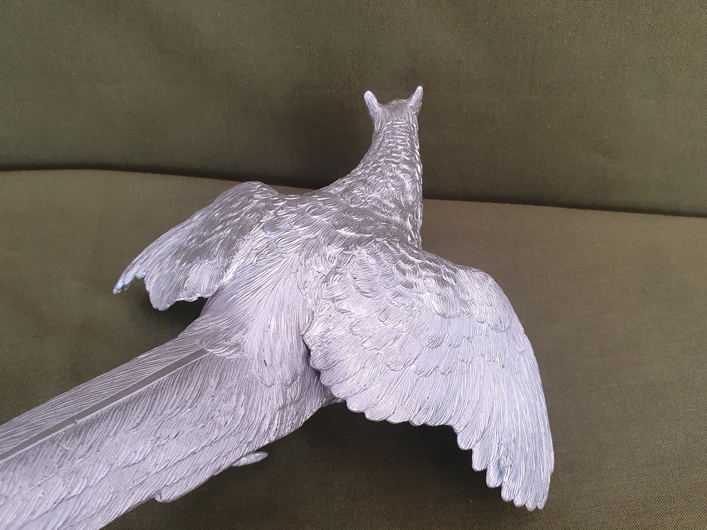 Pair of solid silver pheasants. Cast, fine hand chased detail. 1.945KG. 28 & 32 CM.