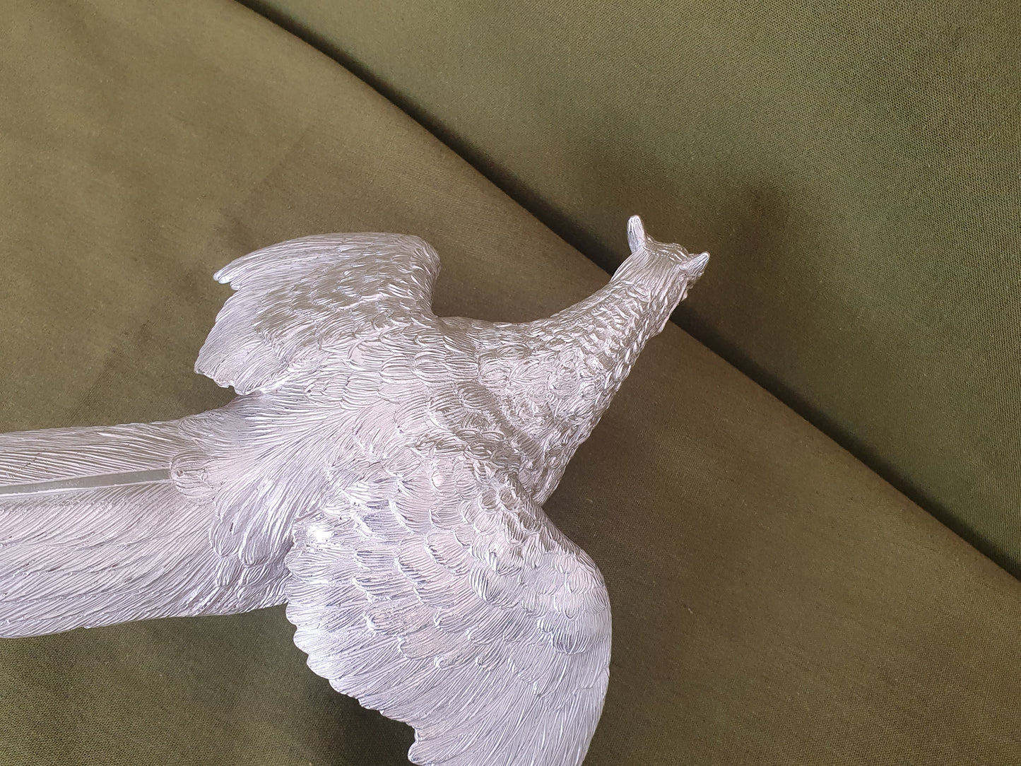 Pair of solid silver pheasants. Cast, fine hand chased detail. 1.945KG. 28 & 32 CM.