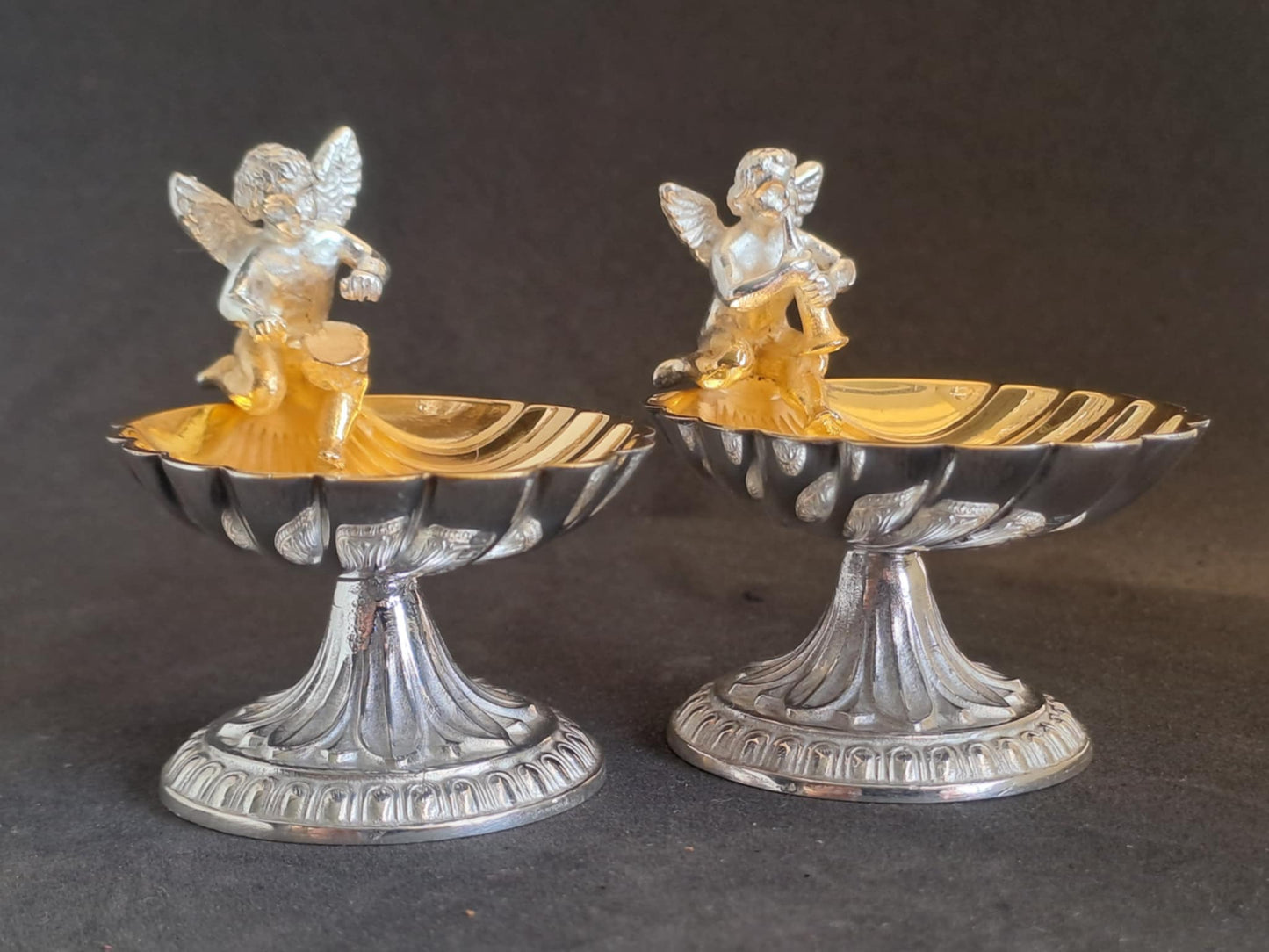 Fantastic Pair of solid silver individual cast table salts with cherub musicians.