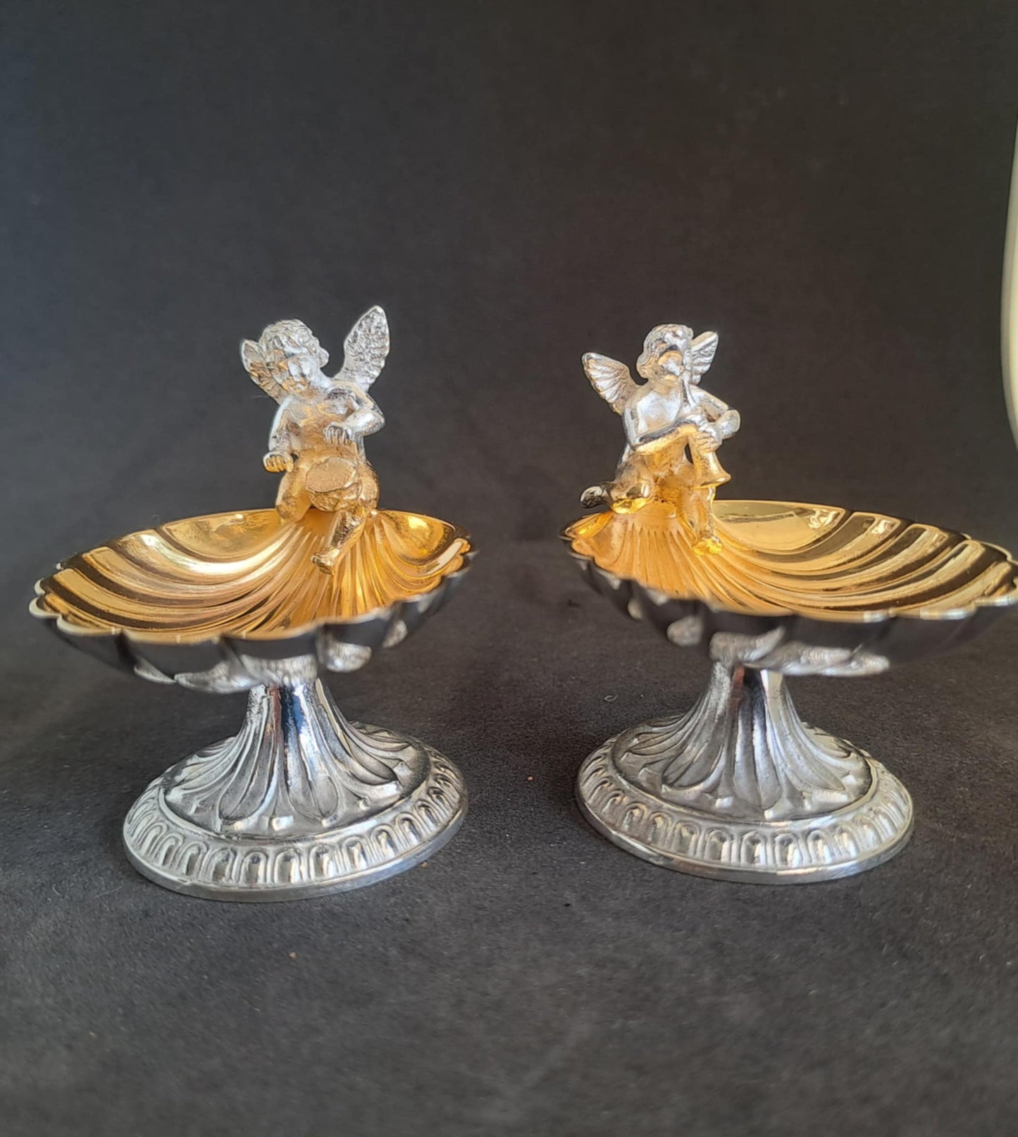 Fantastic Pair of solid silver individual cast table salts with cherub musicians.