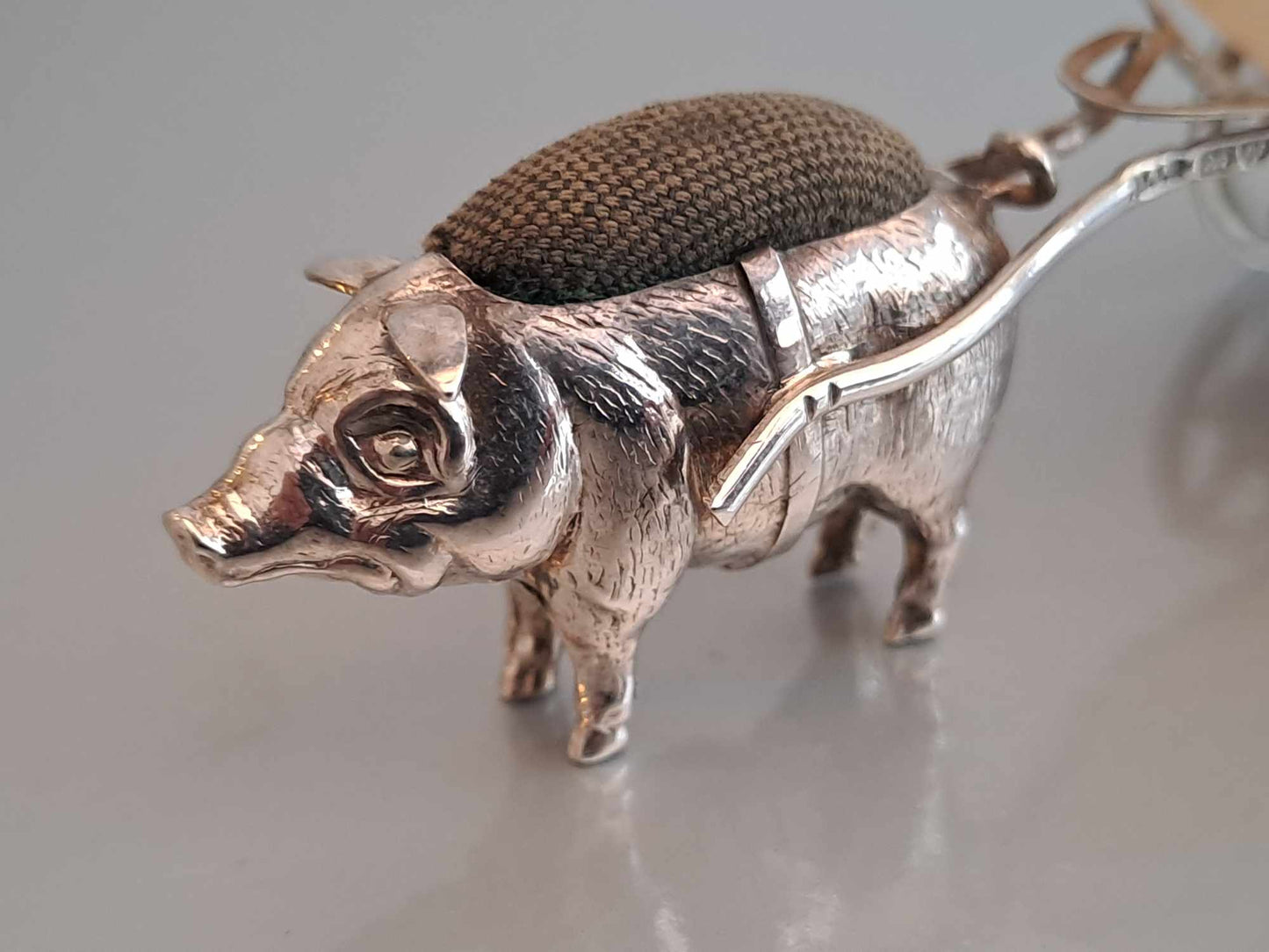 Solid silver pig pin cushion with mother of pearl cart. Adie & Lovekin. Chester 1912.