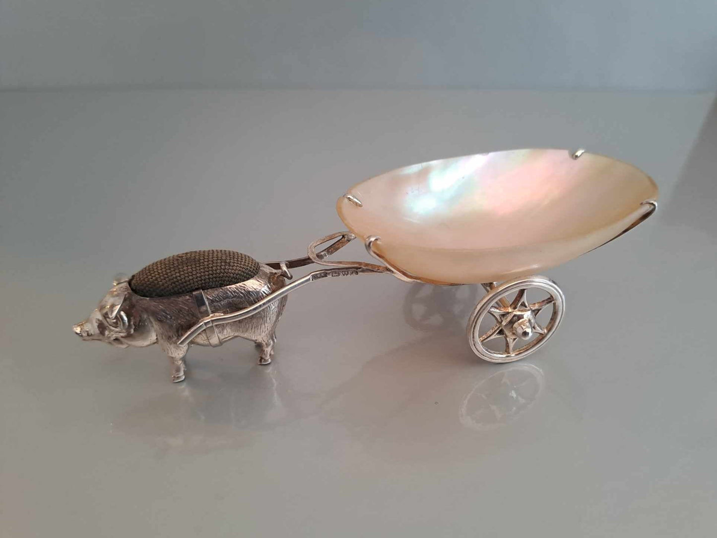 Solid silver pig pin cushion with mother of pearl cart. Adie & Lovekin. Chester 1912.