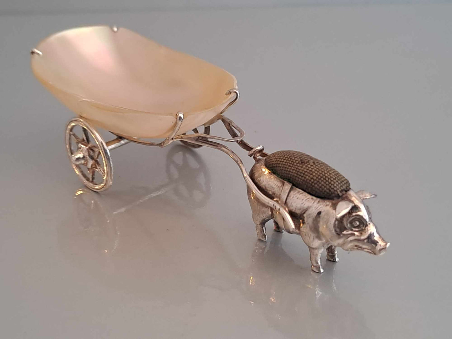 Solid silver pig pin cushion with mother of pearl cart. Adie & Lovekin. Chester 1912.