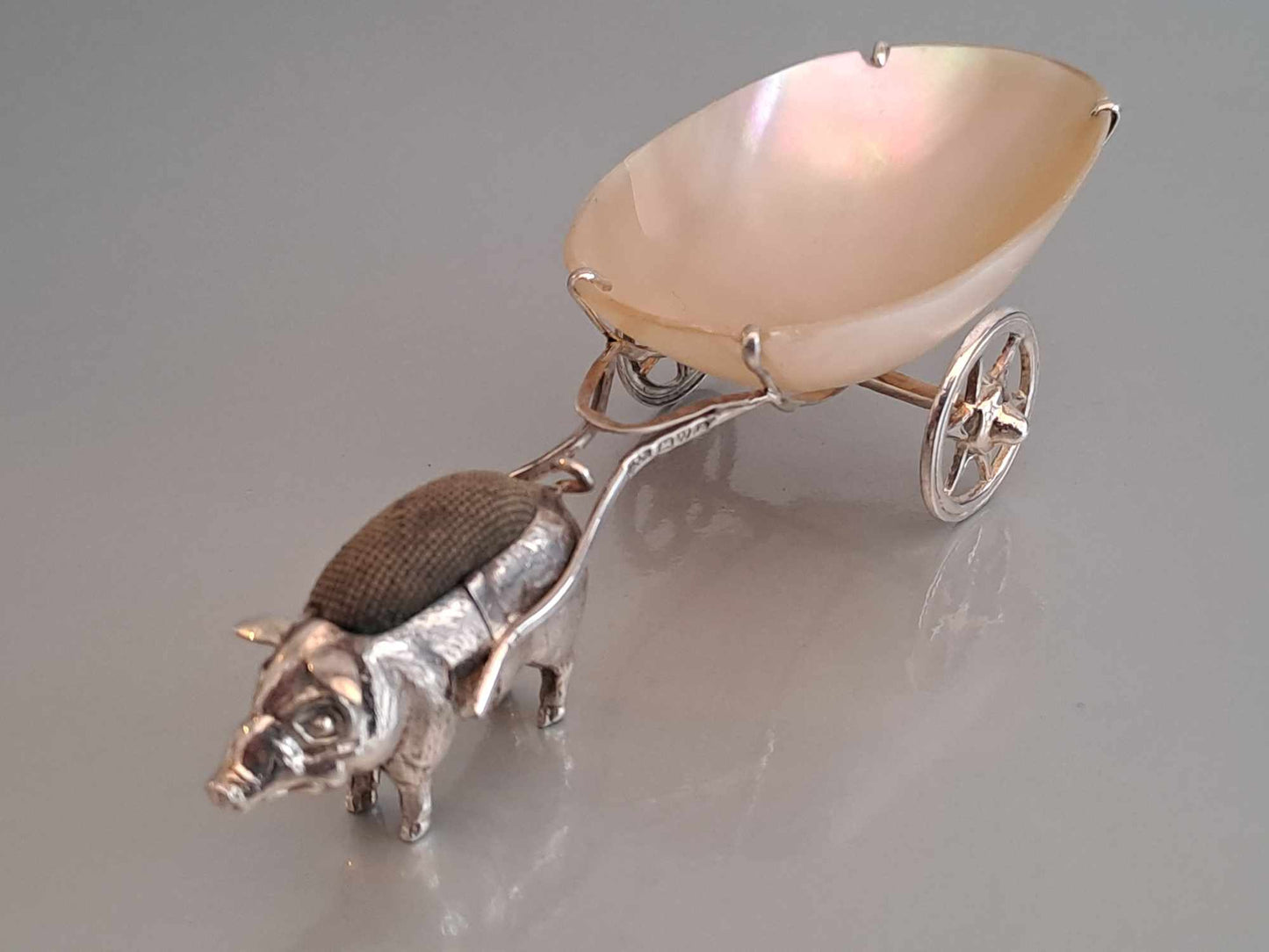 Solid silver pig pin cushion with mother of pearl cart. Adie & Lovekin. Chester 1912.