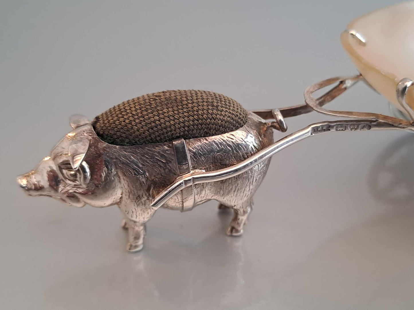Solid silver pig pin cushion with mother of pearl cart. Adie & Lovekin. Chester 1912.
