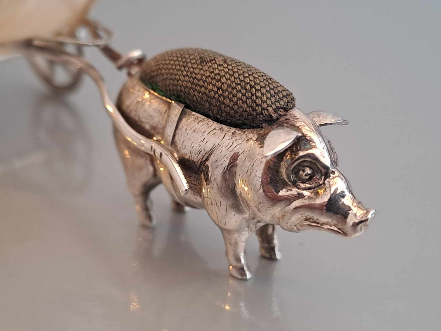 Solid silver pig pin cushion with mother of pearl cart. Adie & Lovekin. Chester 1912.