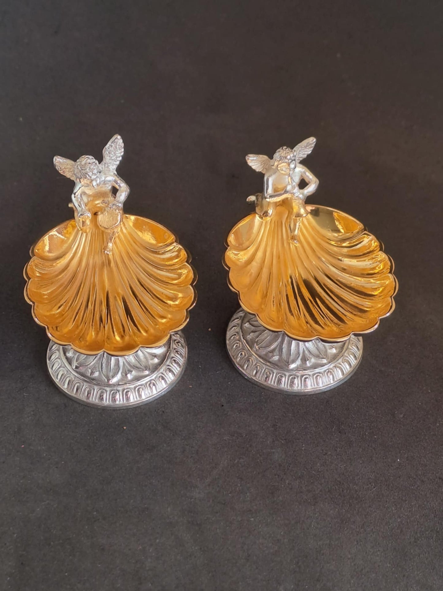 Fantastic Pair of solid silver individual cast table salts with cherub musicians.