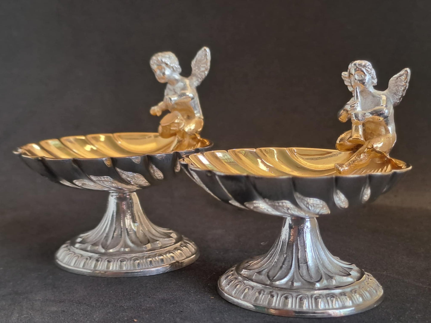 Fantastic Pair of solid silver individual cast table salts with cherub musicians.