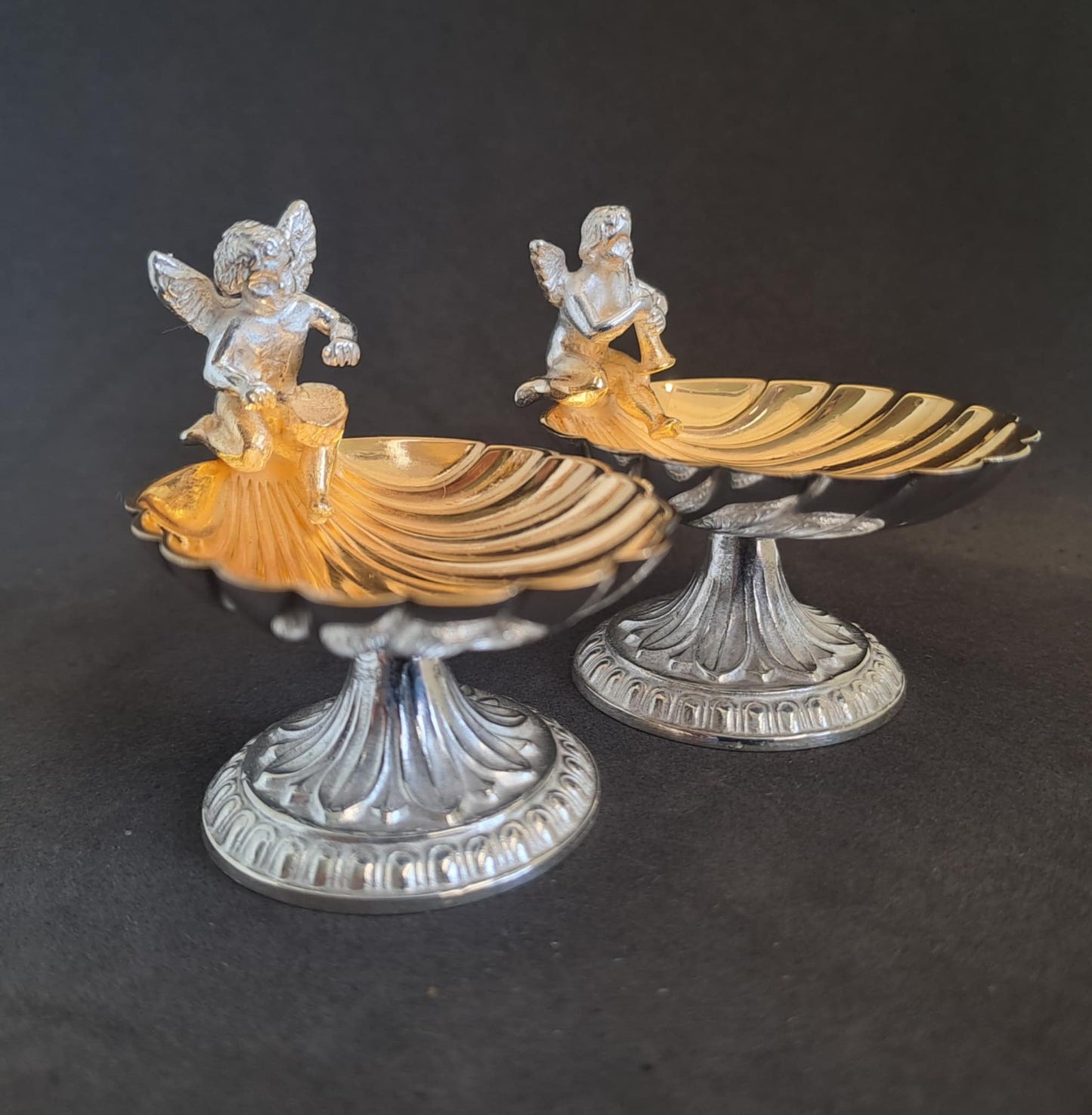 Fantastic Pair of solid silver individual cast table salts with cherub musicians.