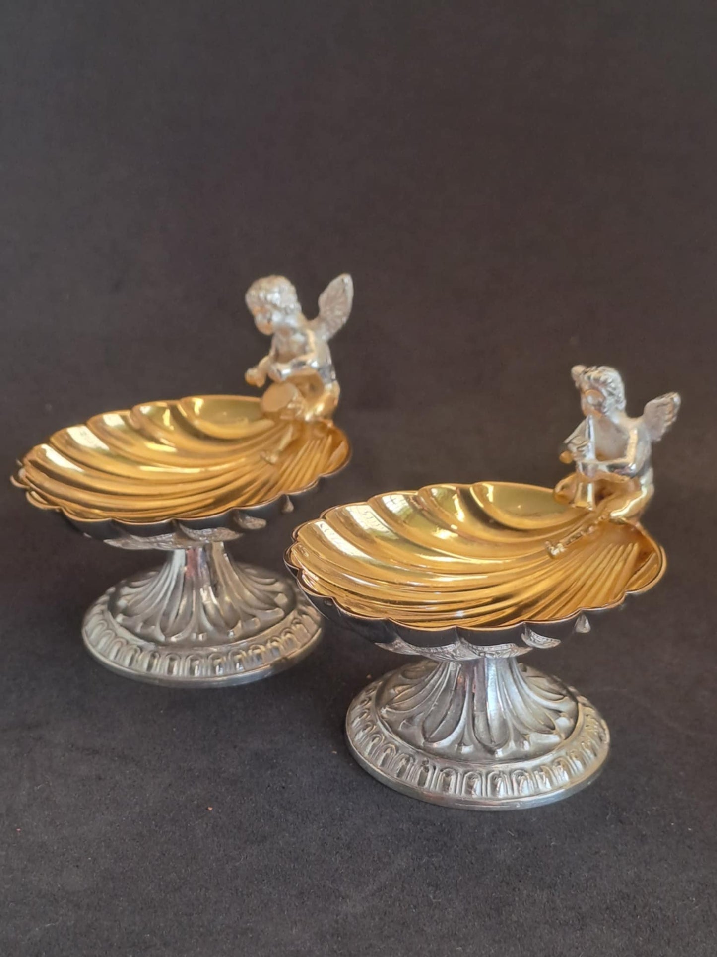 Fantastic Pair of solid silver individual cast table salts with cherub musicians.