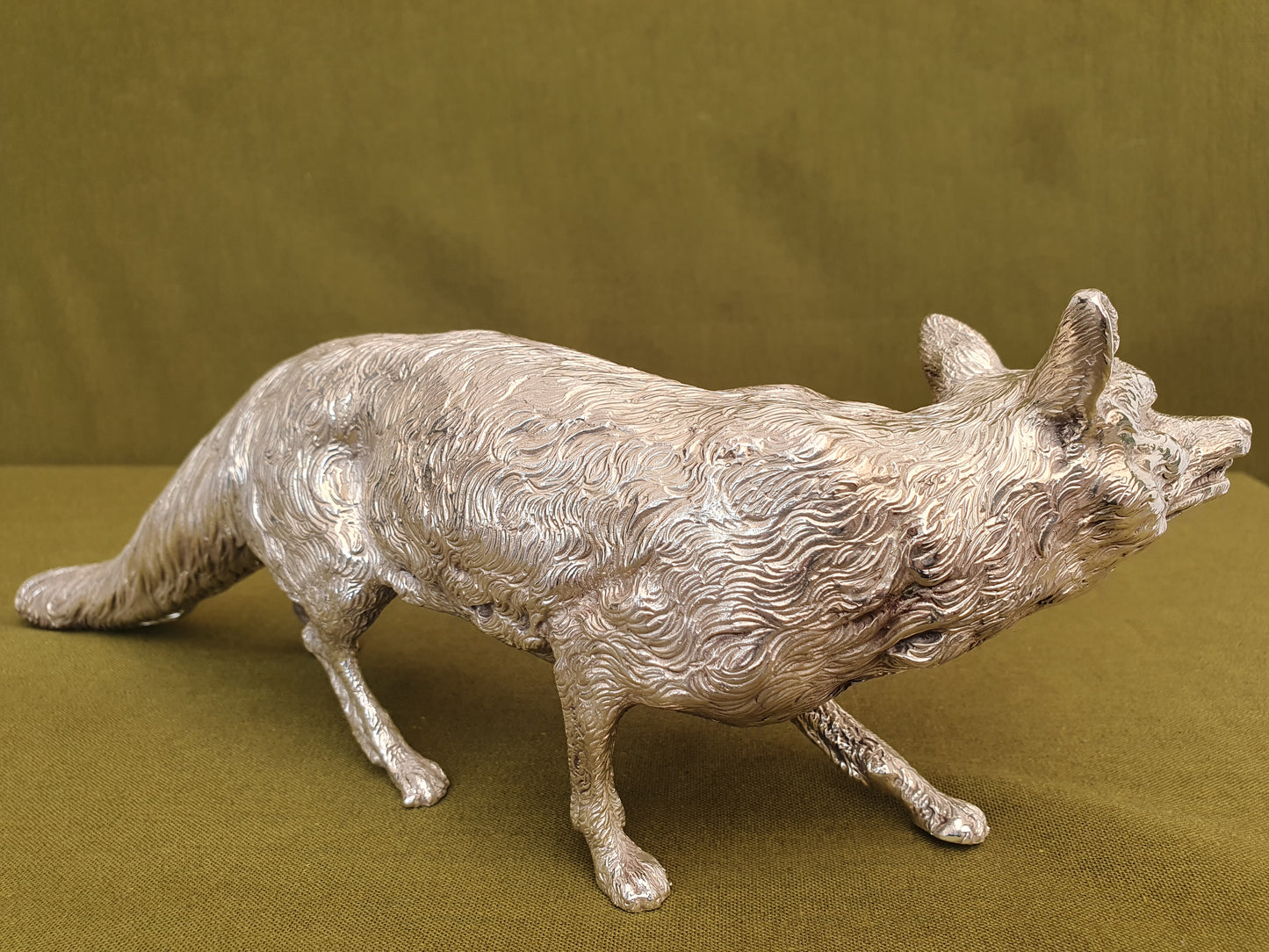 Solid silver fox. Cast, with fine hand chased detail. 32CM long. 1.35 KG