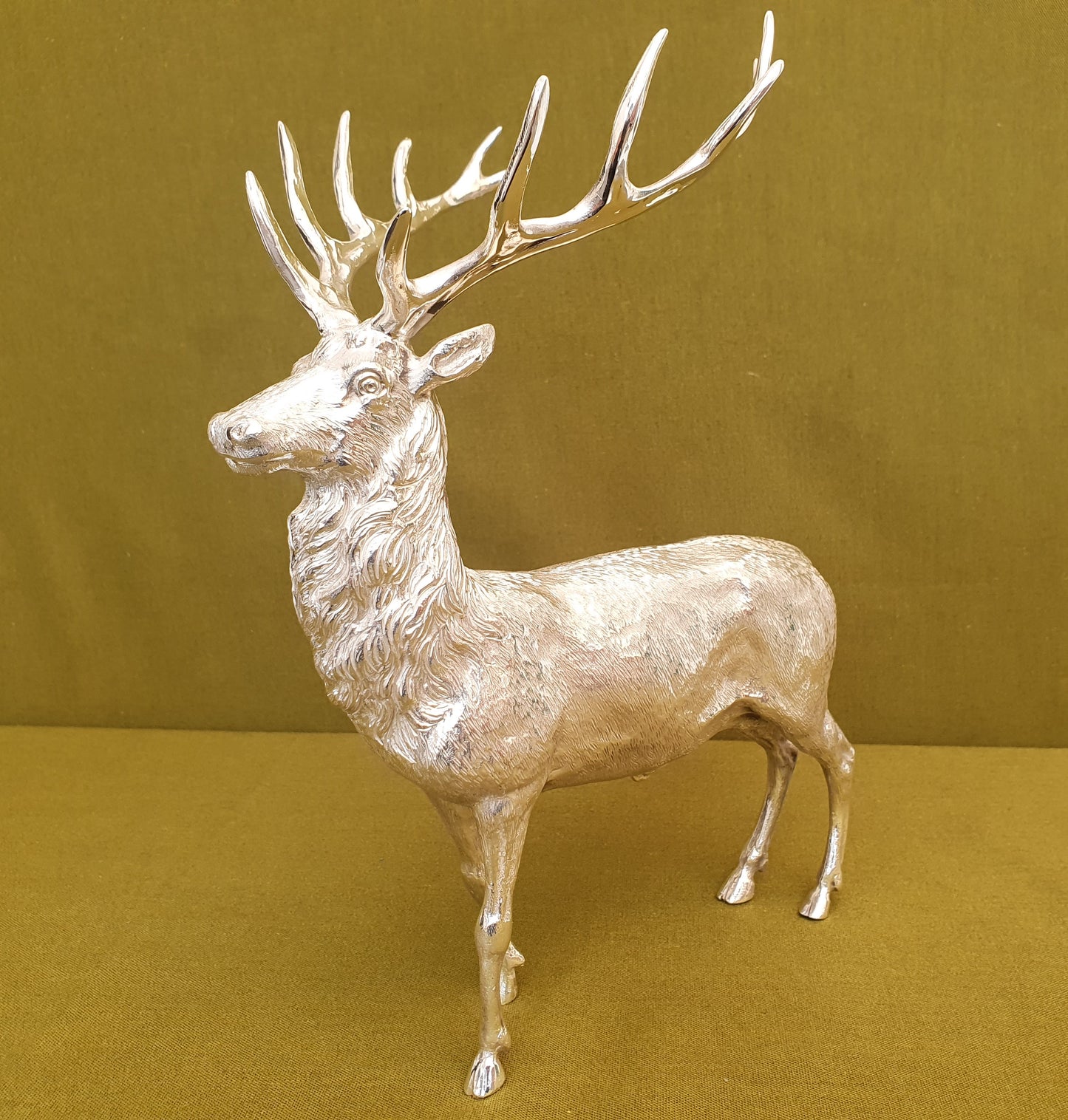 Solid silver stag. Cast, with fine hand chased detail. 24 CM tall. 930 grams.