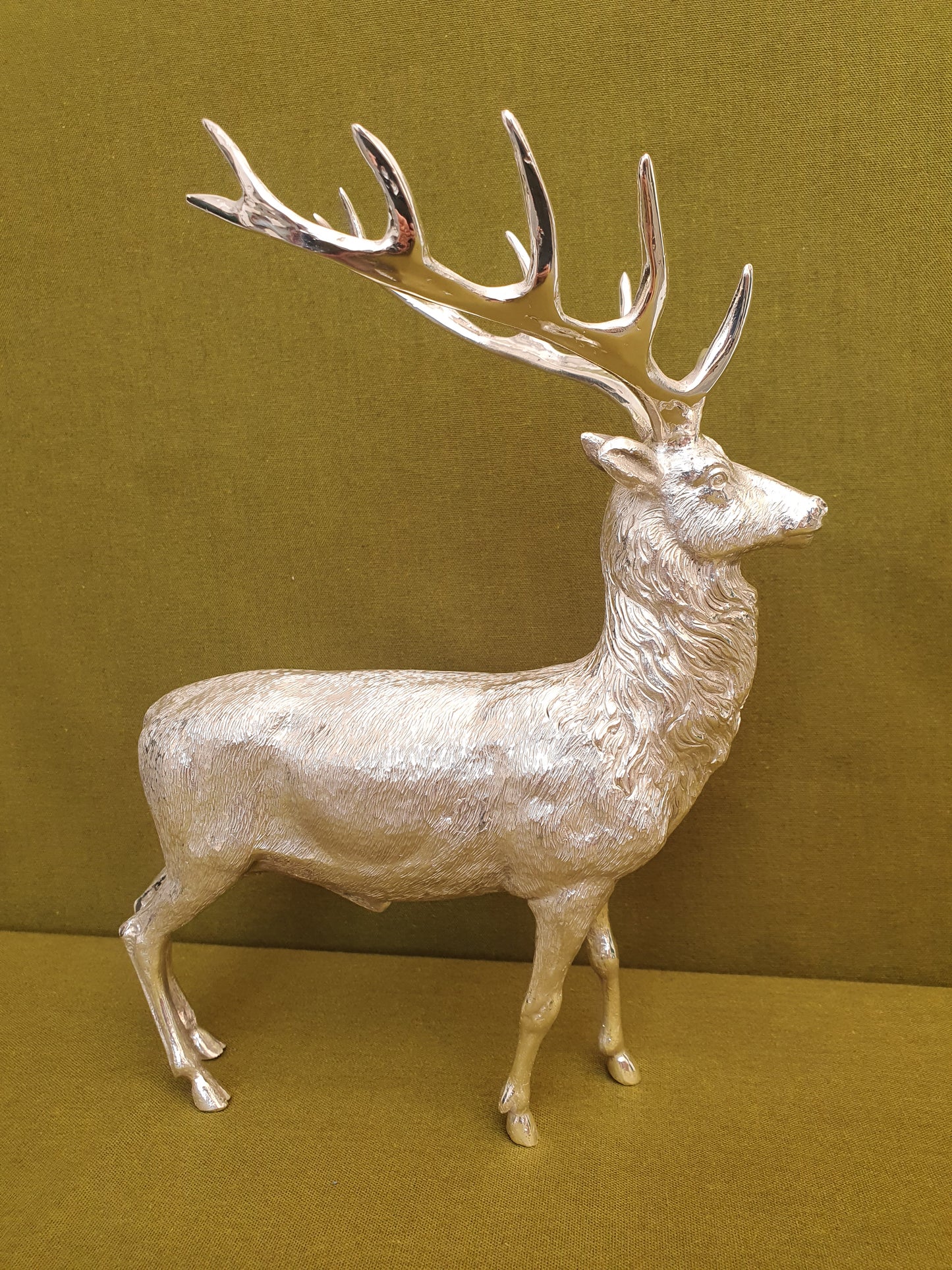 Solid silver stag. Cast, with fine hand chased detail. 24 CM tall. 930 grams.