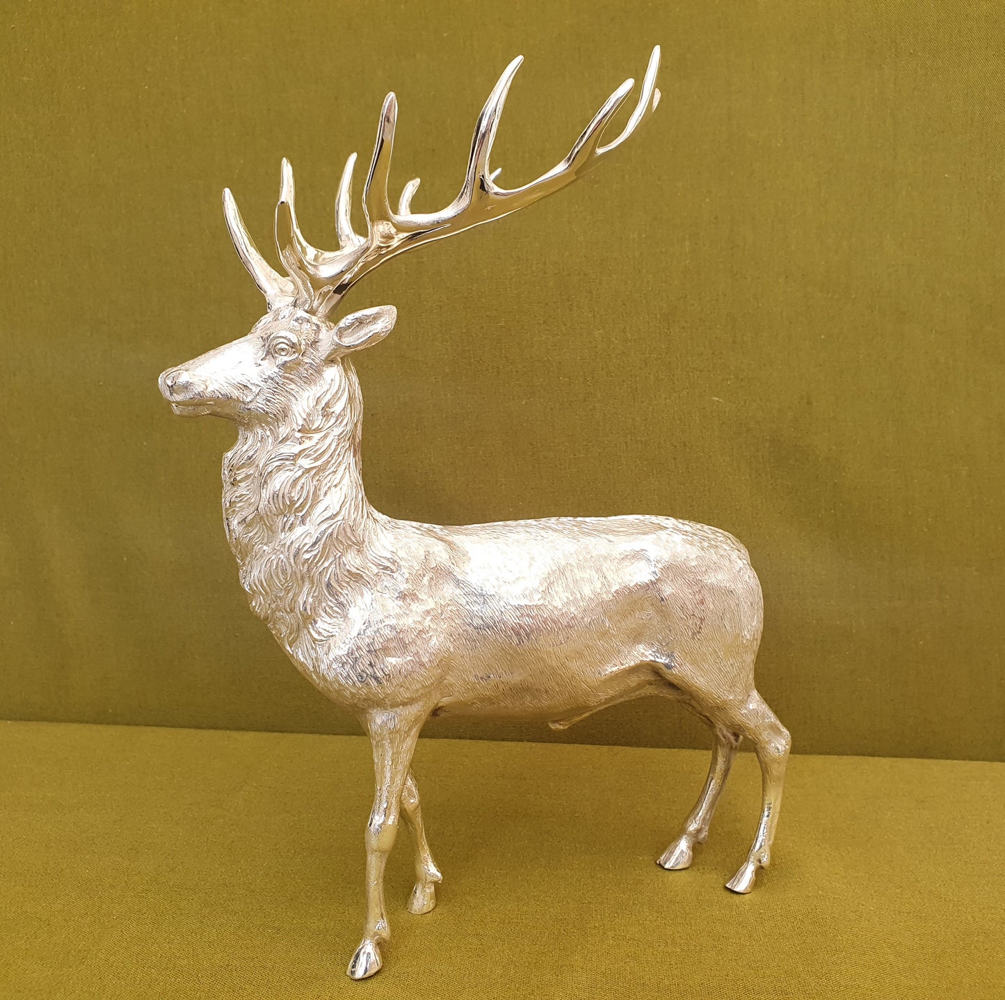 Solid silver stag. Cast, with fine hand chased detail. 24 CM tall. 930 grams.