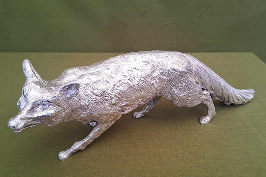 Solid silver fox. Cast, with fine hand chased detail. 32CM long. 1.35 KG