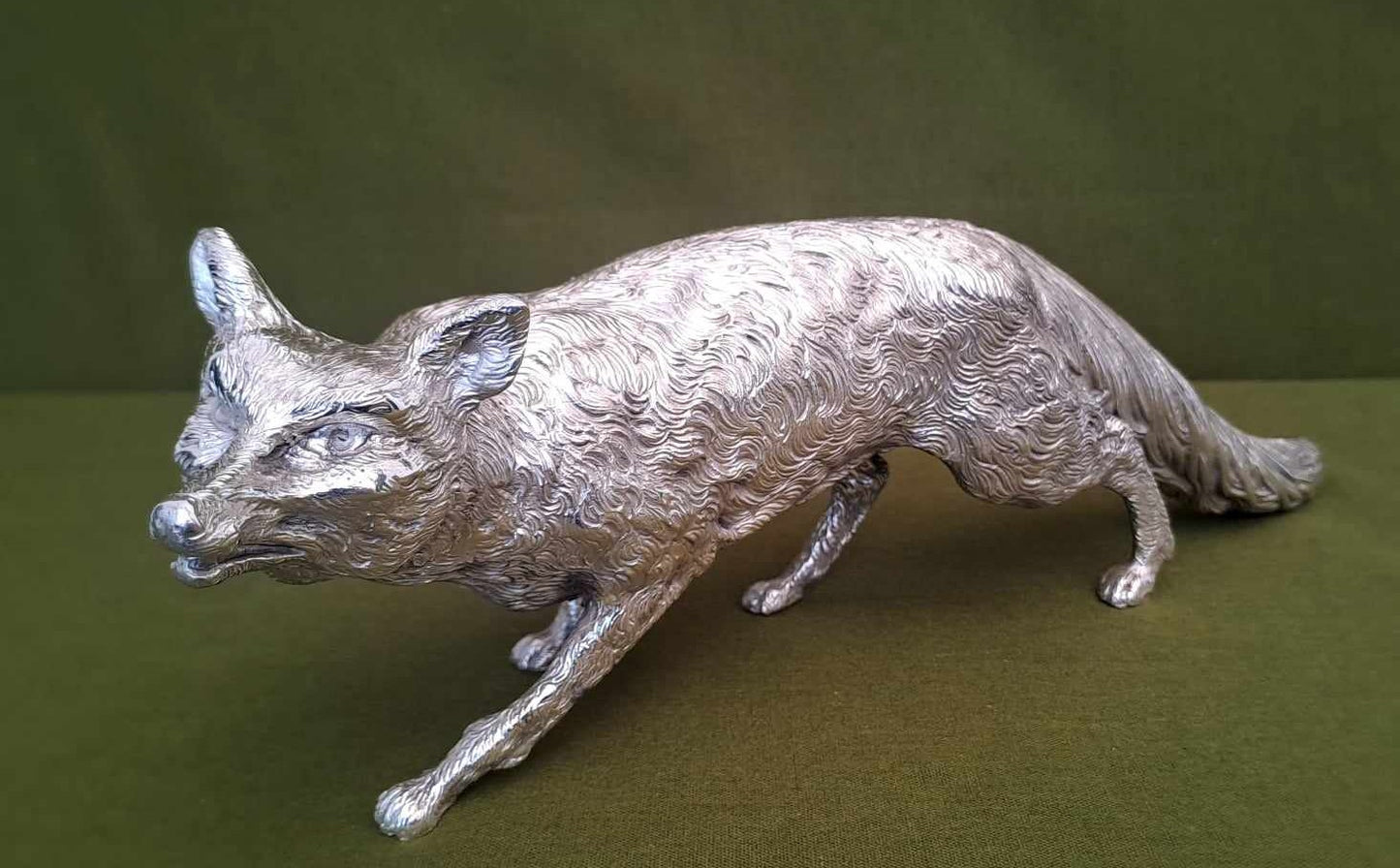 Solid silver fox. Cast, with fine hand chased detail. 32CM long. 1.35 KG