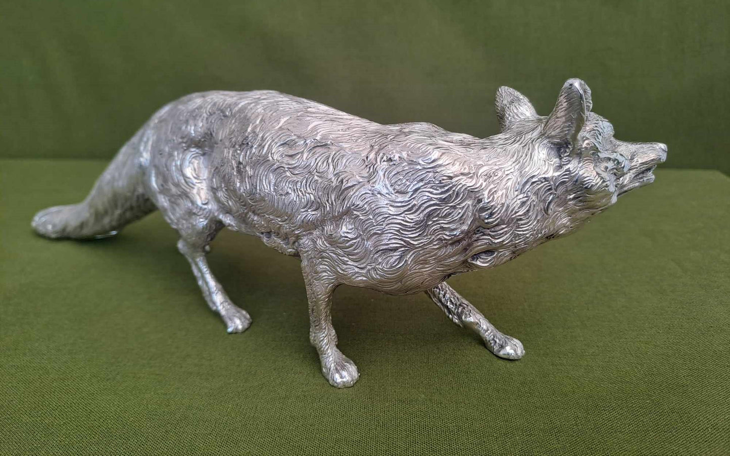 Solid silver fox. Cast, with fine hand chased detail. 32CM long. 1.35 KG