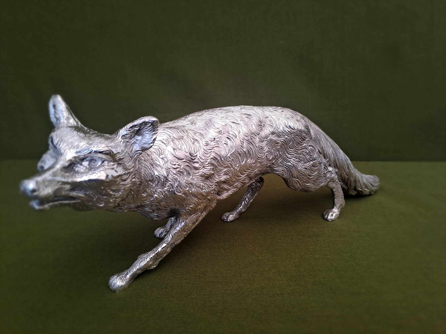 Solid silver fox. Cast, with fine hand chased detail. 32CM long. 1.35 KG