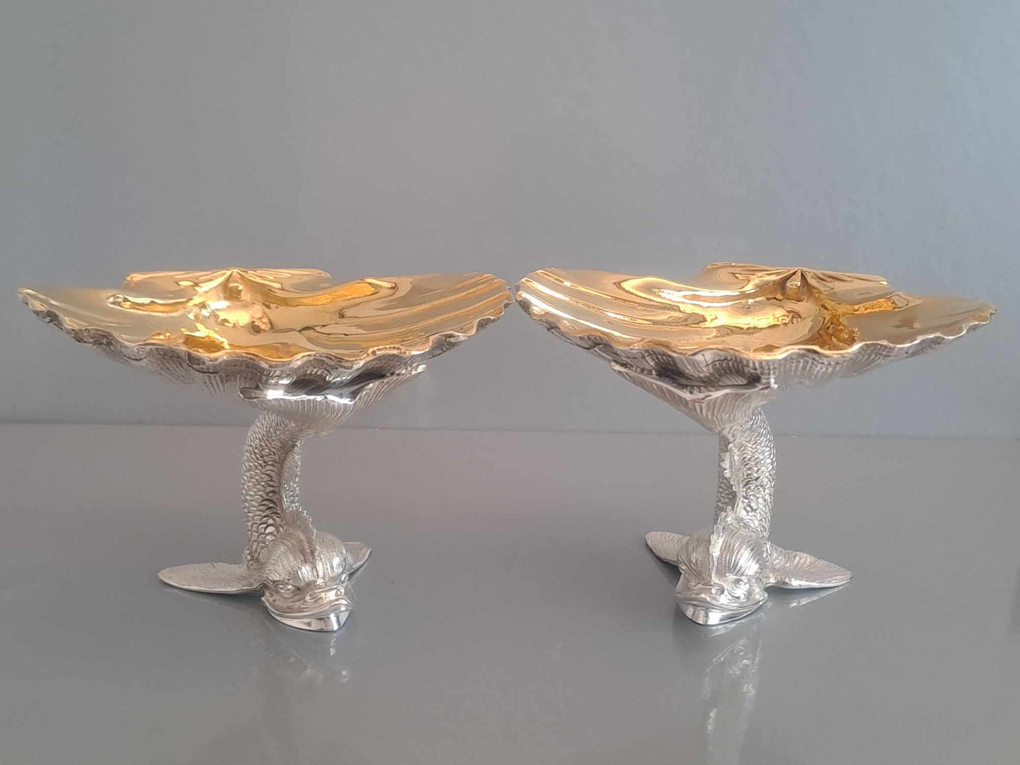 Pair of solid silver dolphin & scallop dishes. Sheffield 2024.