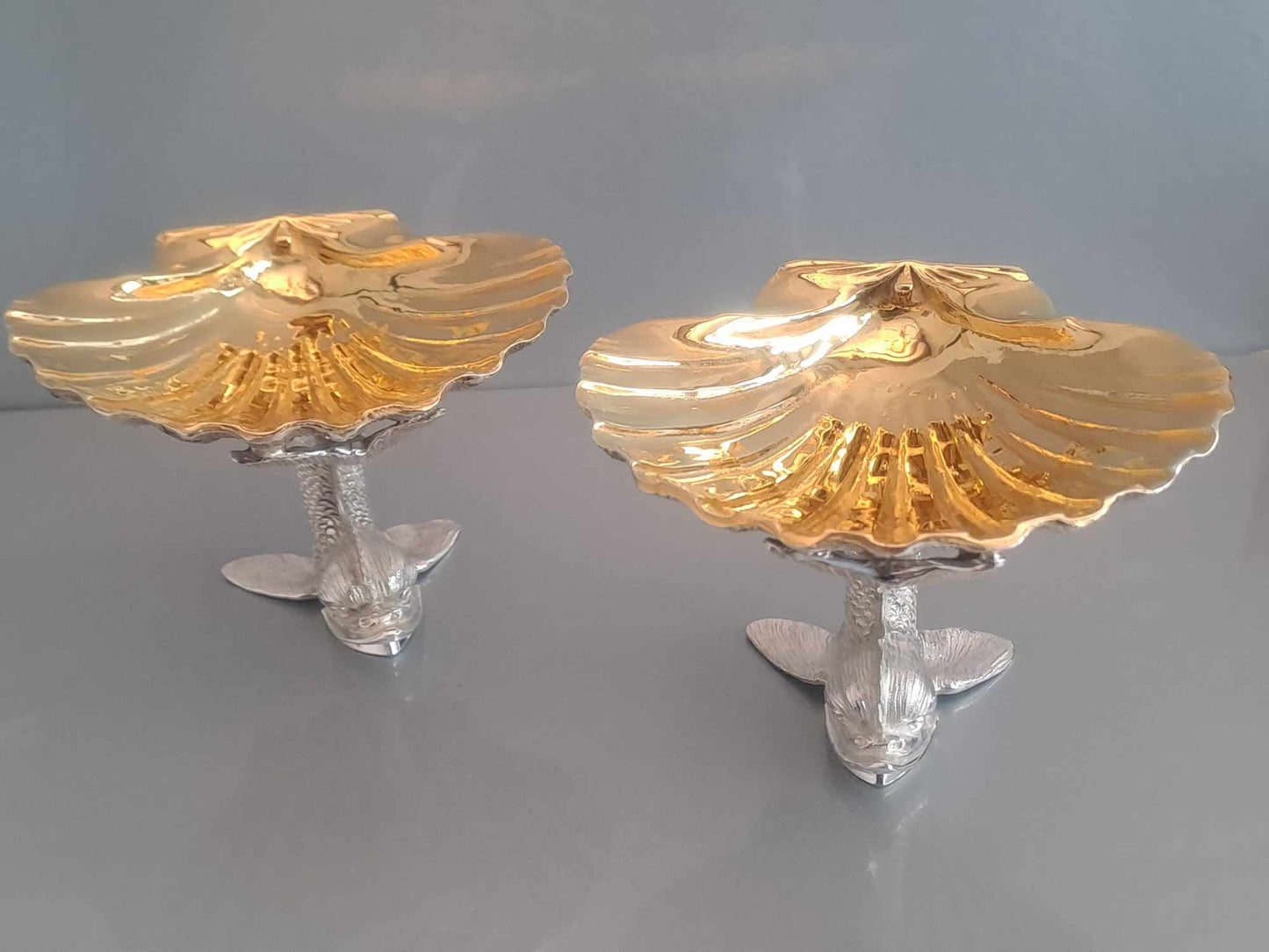 Pair of solid silver dolphin & scallop dishes. Sheffield 2024.