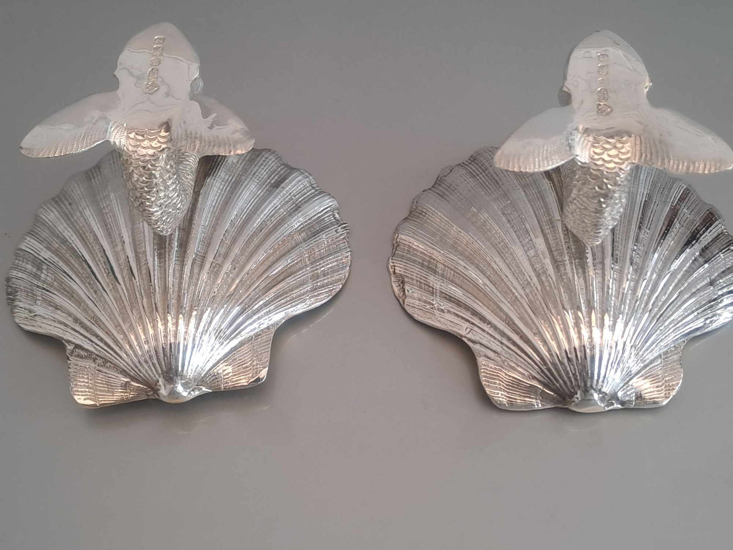 Pair of solid silver dolphin & scallop dishes. Sheffield 2024.