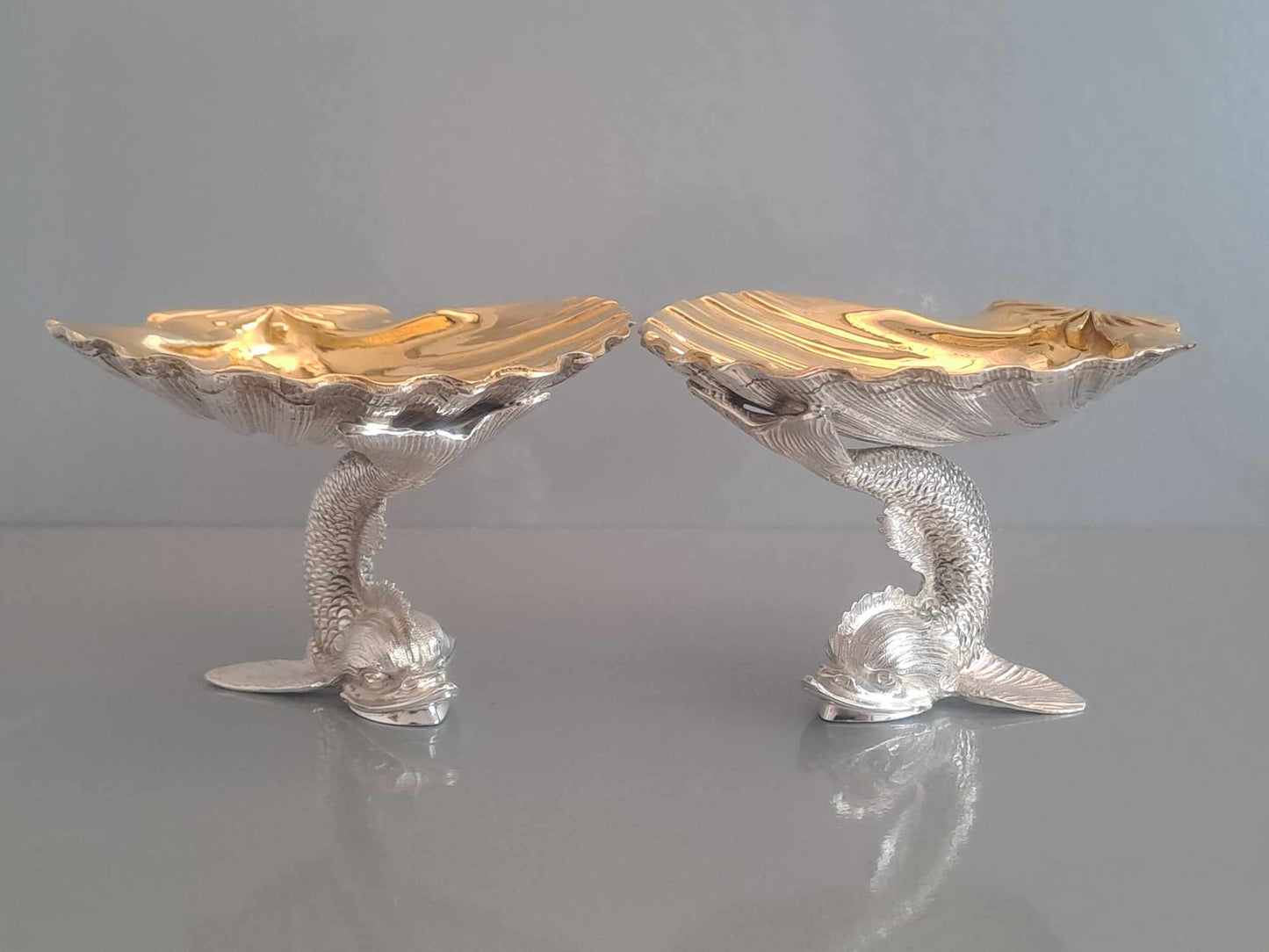 Pair of solid silver dolphin & scallop dishes. Sheffield 2024.